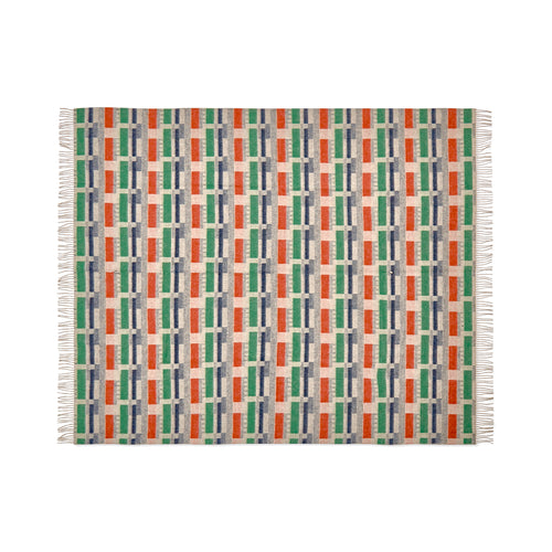 Kit Kemp for Christopher Farr Green and Orange 100% Merino wool throw. Made in England, it showcases an intricate design combining rich jewel-tone colours, offering a vibrant statement piece with the softness of premium wool.