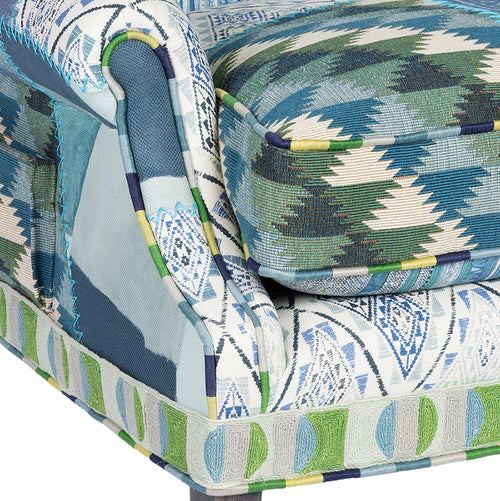 Famous kit kemp fabrics and bespoke piping and embroidered details in the collector's chair edition