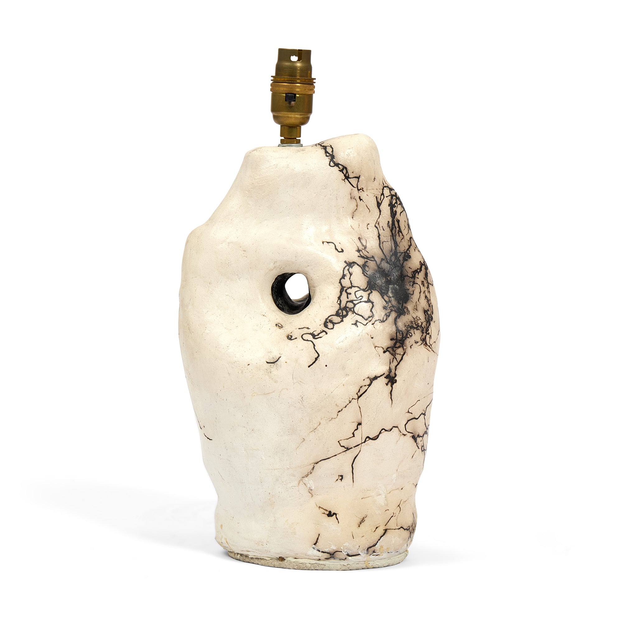 Close-up of Sister Three, a raku-fired table lamp with white horse-hair marble pattern.