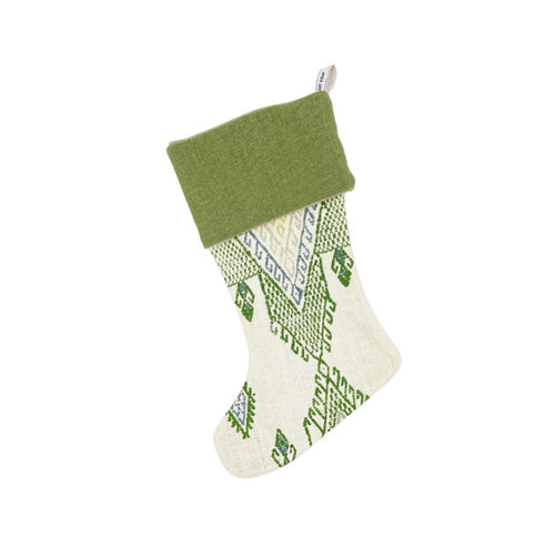 Artisan-style Christmas stocking featuring Kit Kemp's 'Travelling Light' weave. The intricate geometric design in shades of crisp green and blue on an ivory background offers a fresh, earthy take on festive decor. A luxurious and unique piece, perfect for sophisticated holiday gifting.