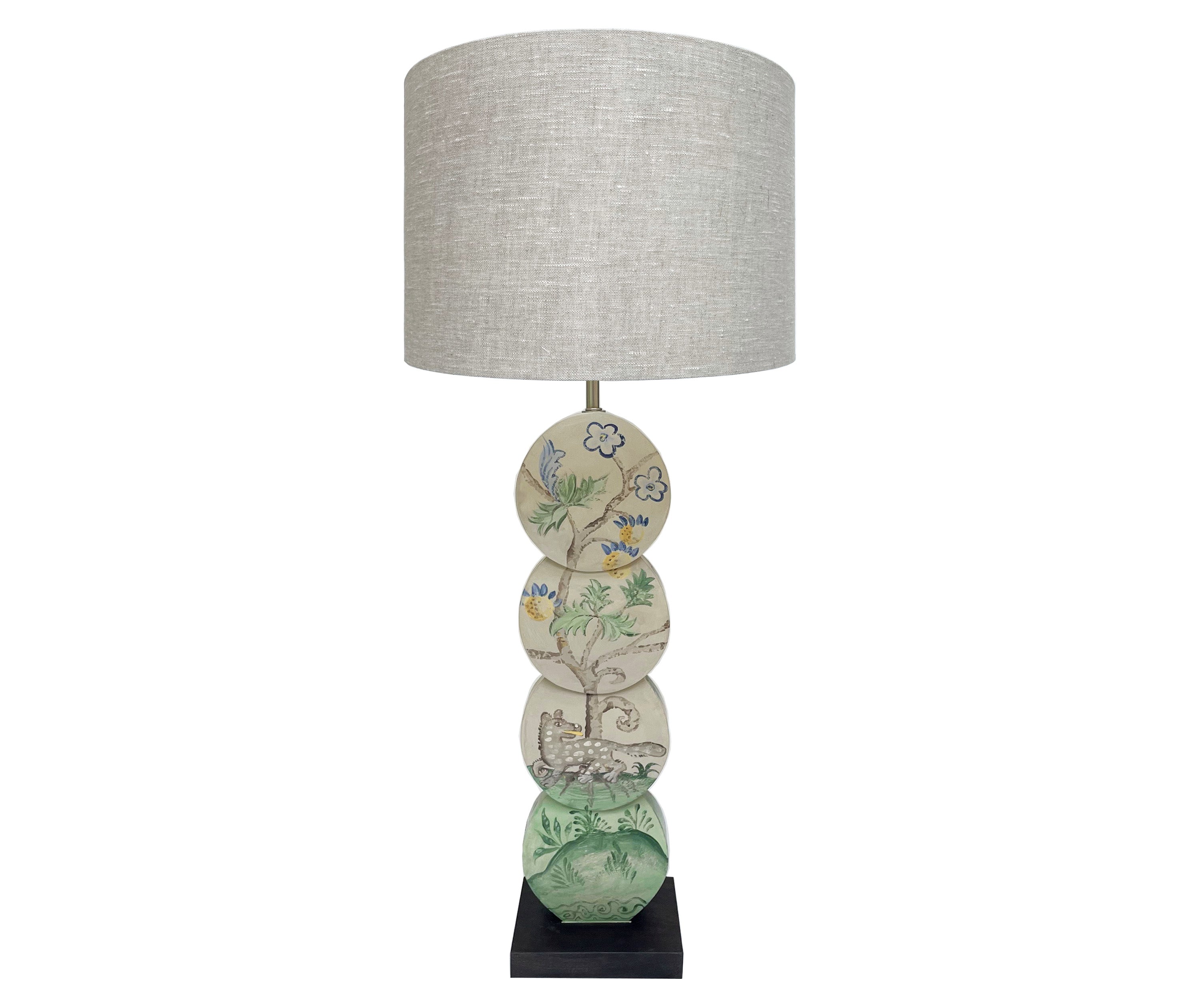 Using Kit's fabric design as inspirations the Hedgerow Quince leopard lamp, is hand painted by Melissa White, and features a grey leopard, under a fruit laden tree, in muted shades of greys, greens, blues and yellow , on a lamp base constructed out of 4 intersecting discs.