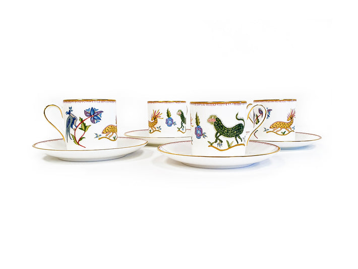 Four Wedgwood Mythical Creatures Espresso cups with saucers, showing a series of characters and patterns that have a primitive, folkloric feel.