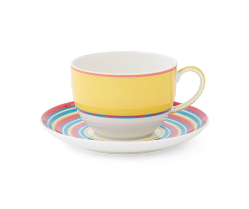 Calypso Yellow Cup and Saucer is adorned with a wide yellow stripe, accented with turquoise and pink bands above and below, the porcelain cup sits on a matching striped saucer.