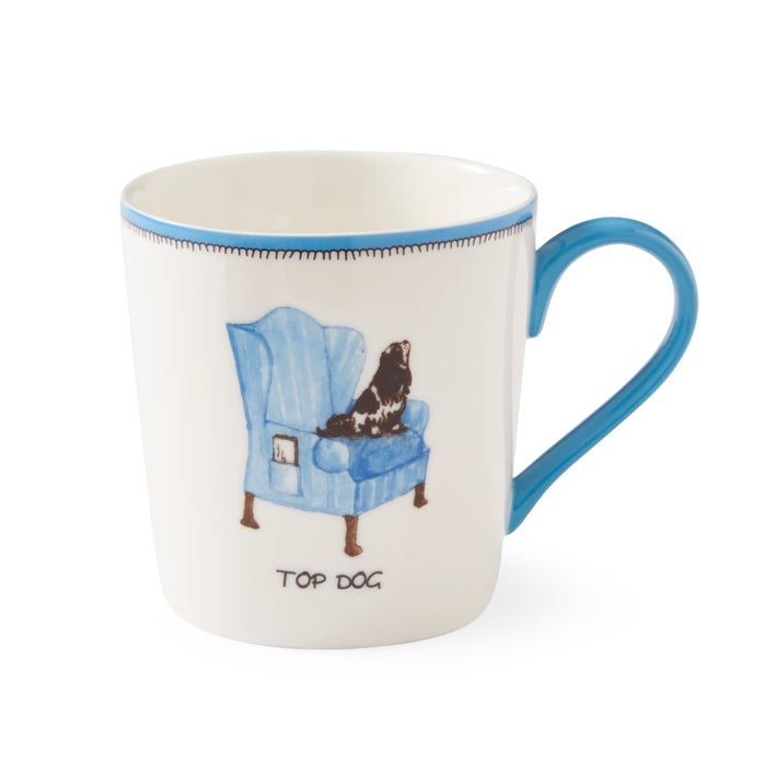 This pale blue and white doodle mug, with Kit's King Charles Spaniel, taking up position on a blue Wing Chair perfectly illustrating, his position in the family as the Top Dog .