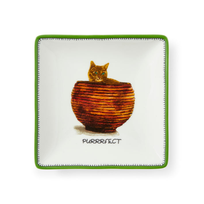 The white and green ,square trinket tray is a joyful it features a cheeky ginger cat, embracing the joy of relaxation whilst hiding in the orange and gold laundry basket .