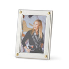 Kit Kemp's Cabochon silver plated photo frame, takes its inspiration from design details found on her furniture, and feature 4 contrasting gold domes in all four corners of the frame, for a 4x6 photo