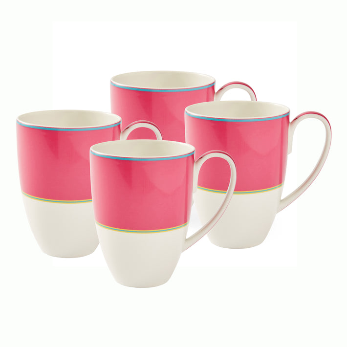 A set of 4 Pink Calypso Mugs , which are large white mugs, with a wide pink band, bordered by narrow central stripes in green and yellow, and tipped with a blue outer band. Sold in sets of 4, these mugs are a handful of warmth to all the senses.