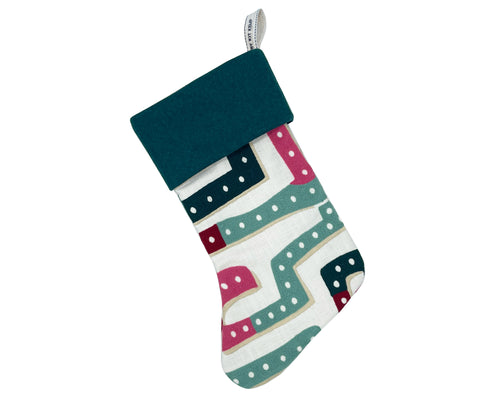 A beautiful, sustainably made festive stocking from the Abstract Pathways collection, featuring a textured weave in shades of blue and pink. This Shop Kit Kemp stocking is crafted from fabric offcuts, giving a new life to materials and reducing waste.
