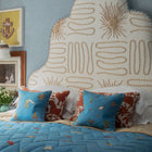 Bedding arrangement for Firmdale hotels by kit Kemp with Buzz Off cushions by Kit Kemp for The Chelsea Textiles collection.