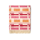 Add a touch of warmth with this premium English-made throw. Woven from 100% Merino wool, the intricate Pink/Orange geometric design, created by Kit Kemp, provides a beautiful pop of colour and the ultimate in soft, luxurious comfort.