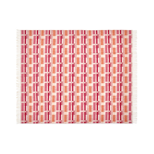 A luxurious 100% Merino wool throw in a warm Pink and Orange colourway. This design, based on a Kit Kemp fabric for Christopher Farr, features an intricate geometric block pattern in cheerful, inviting colours, beautifully made in England.