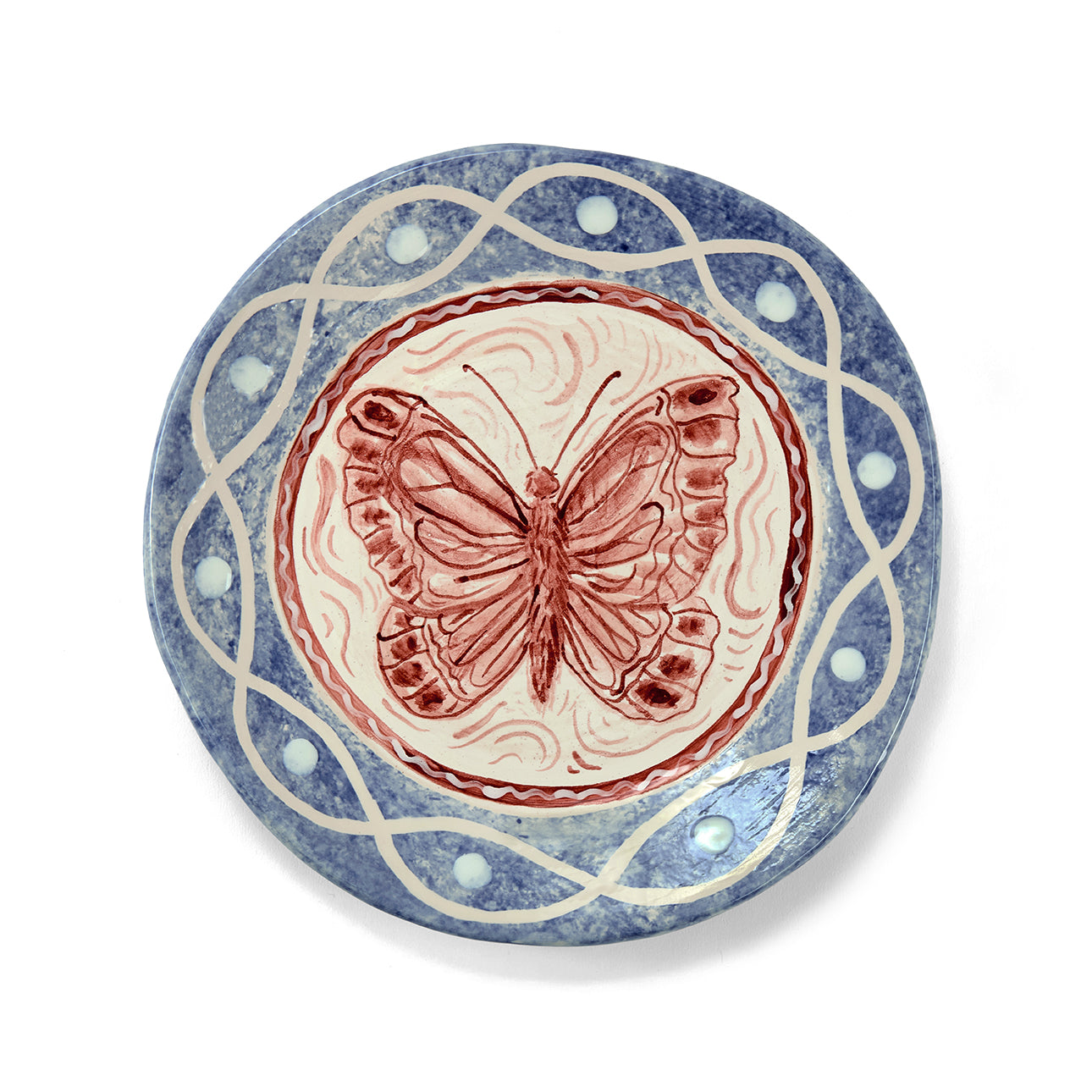 Sasha Compton handmade plate with wild coastal butterfly in centre surrounded by fluid brushstrokes and deeper blue tones. Exclusively for Shop Kit Kemp