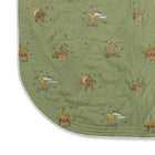 The Buzz Off Quilted Bedspread in Green, revealing the elegant quilted linen construction, embroidered pattern and softly rounded corners by Kit Kemp for Chelsea Textiles.