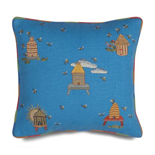 Buzz Off cushion with embroidered bee and beehive patterns, edged with rainbow piping. Exclusively for Shop Kit Kemp.