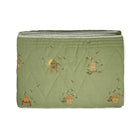 Buzz Off Quilted Bedspread in Green from the Weekend Collection by Kit Kemp - Chelsea Textiles, crafted from quilted linen with embroidered bee and floral motifs and a beautifully bound finish.