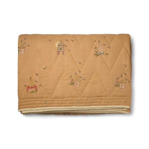 Buzz Off Quilted Bedspread in Yellow from the Weekend Collection by Kit Kemp - Chelsea Textiles, crafted from quilted linen with embroidered bee and floral motifs and a beautifully bound finish.