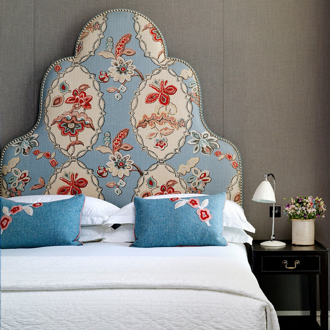  Chainstitch fabric lined headboard, pattern comes from a very large block print repeat from the 1920s, with its interlocking lozenges and botanical details. This generously scaled floral design once carved into wooden blocks is now transferred onto fabric in multiple layers of colour. 