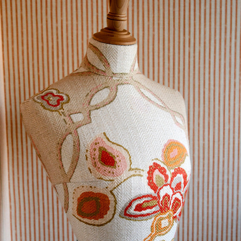 Close up on chainstitch mannequin fabric, upholstered over a paper mache shape exclusive at Shop Kit Kemp.