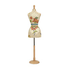 Decorative mannequin with floral patterns on a white background