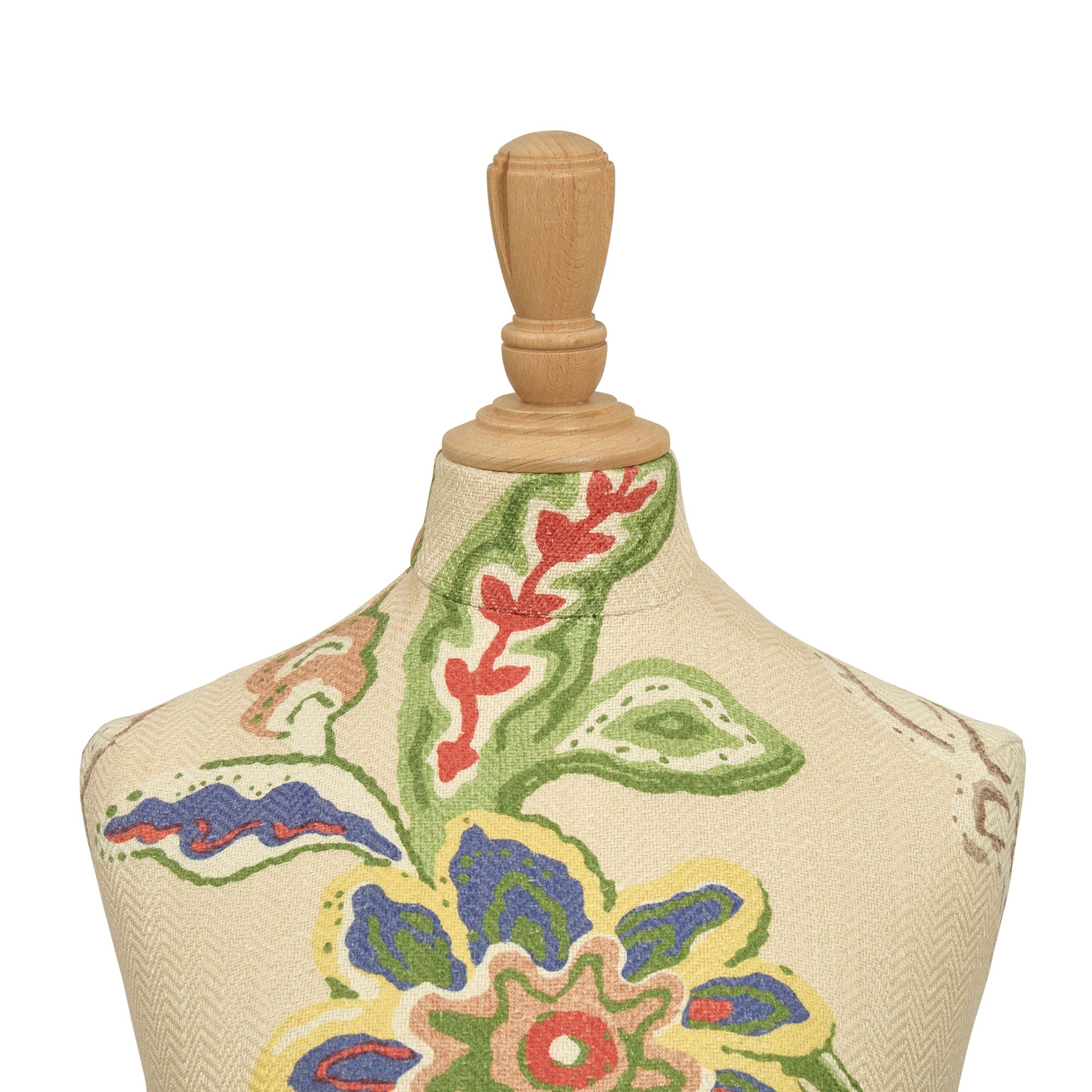 Mannequin torso with floral embroidery on a white background