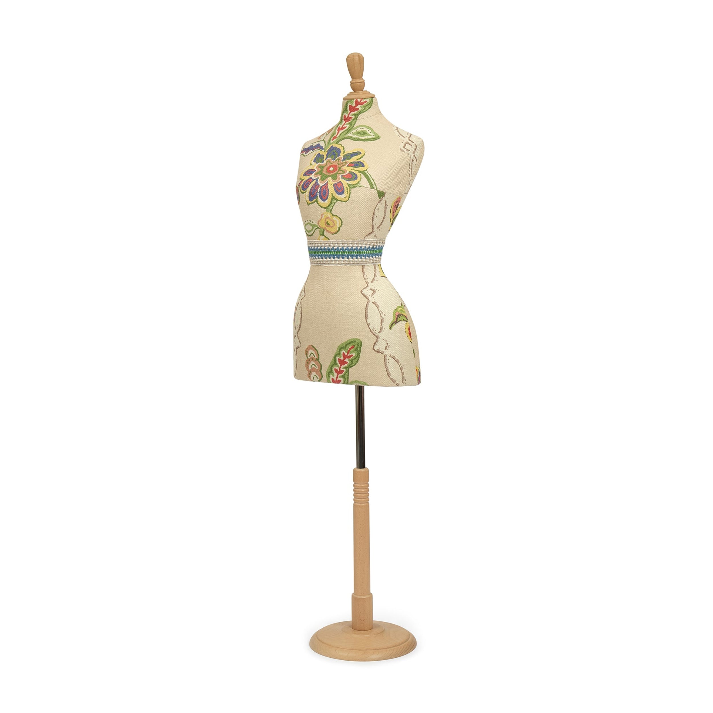 Mannequin torso with floral patterns on a stand against a white background