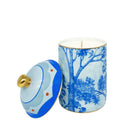 Kit Kemp Tall Trees blue and white ceramic candle with a floral pattern and a gold lid.