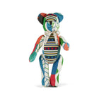 Special edition Willow Bear from the Kit Kemp Patchwork Collection, shown in a seated position against a white background. This artisanal teddy bear features a vibrant mix of patterned fabric offcuts, button eyes, and fully articulated limbs, highlighting its unique 'one-of-a-kind' handmade construction.