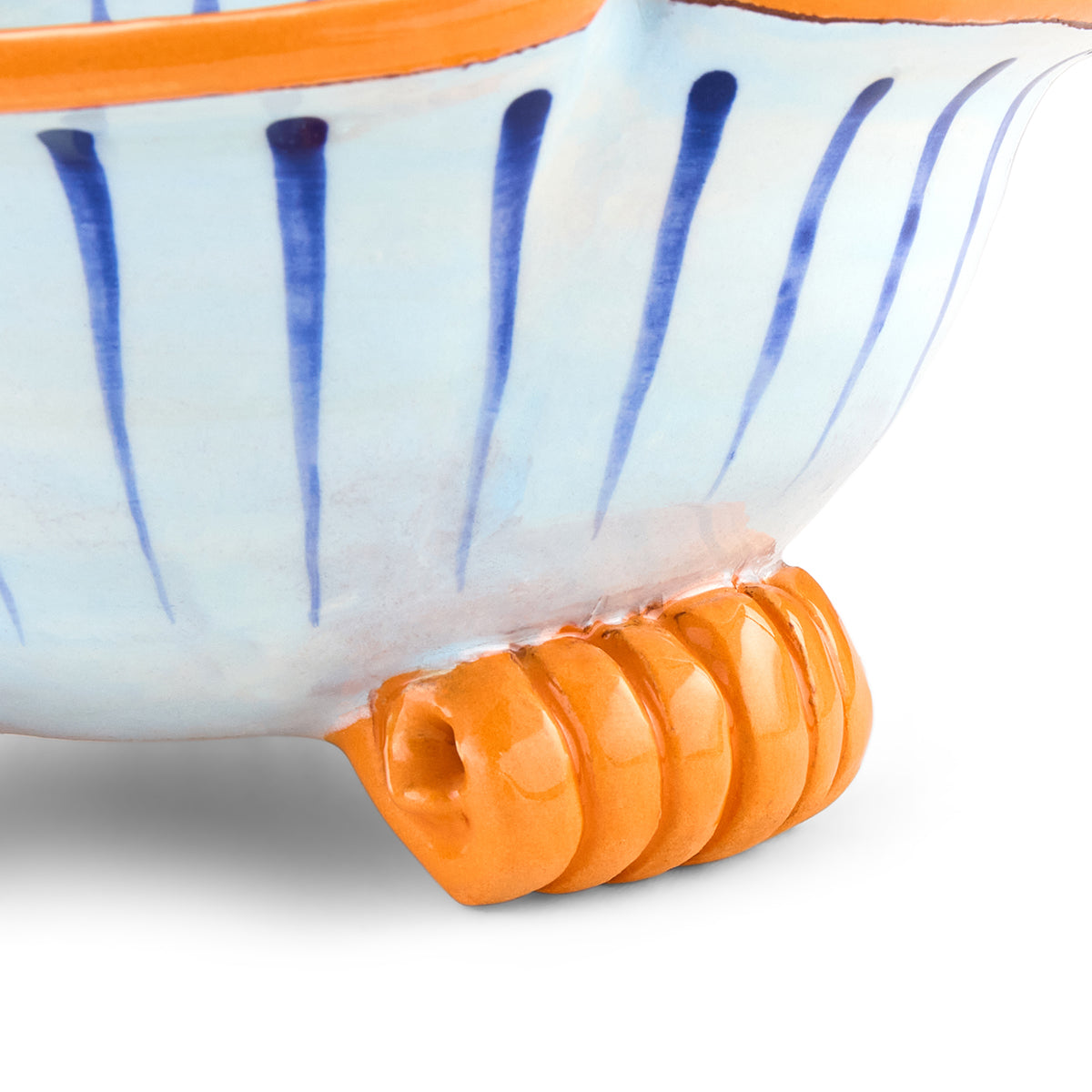 Close up on orange pedestal foot, Crown Emoji artwork.