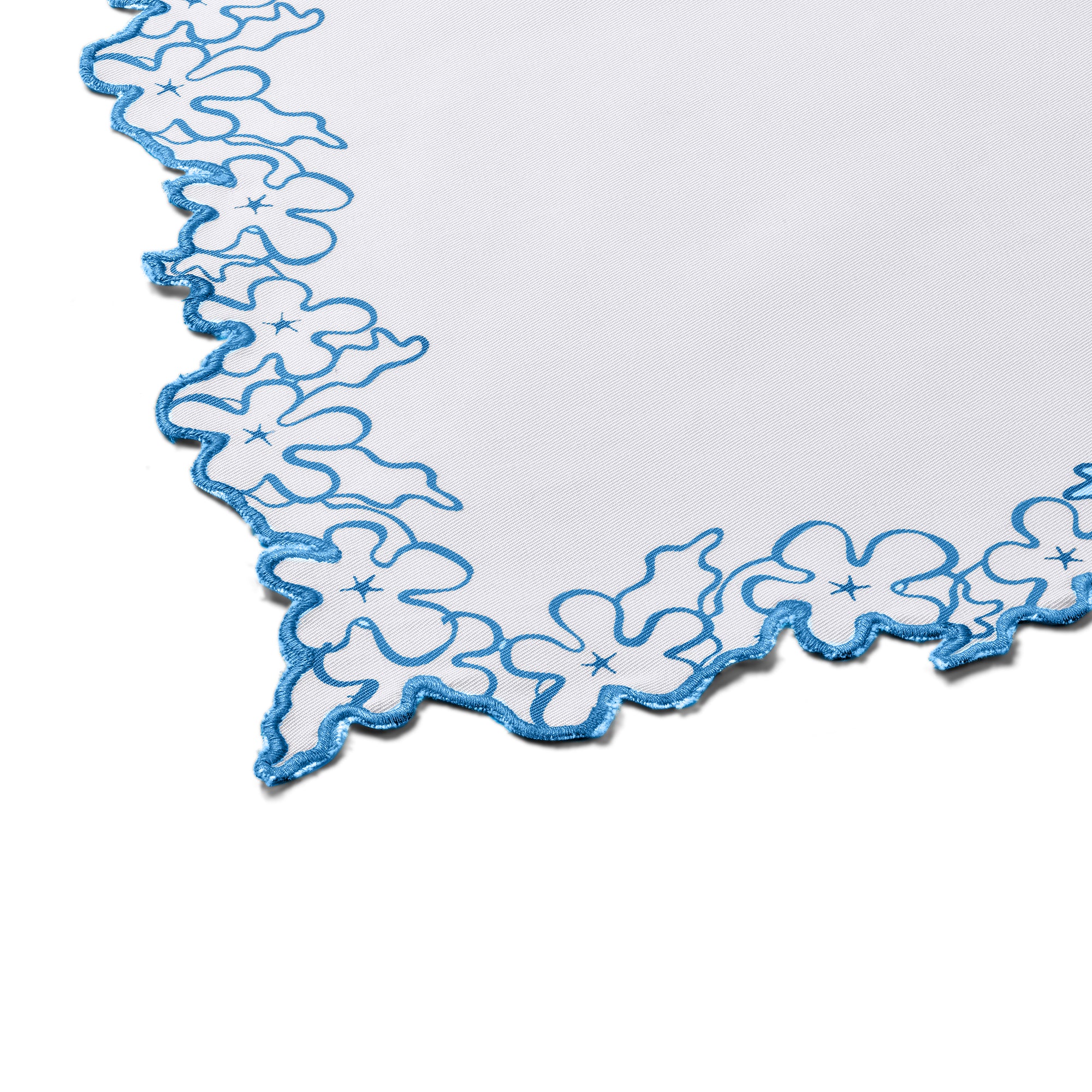 Petal Cutout napkin featuring a detailed blue floral petal border with decorative scalloped cutwork edges. These handmade Indian cotton textiles offer an understated elegance that transitions effortlessly from casual meals to formal gatherings.