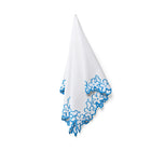 Complete a Kit Kemp dining set with these 50cm x 50cm (20in x 20in) Petal Cutout napkins, featuring delicate blue floral embroidery on white cotton. Handmade in India, these napkins are designed to be styled alongside the Petal Cutout tablecloth and Sailor's Farewell tableware for a sophisticated, layered aesthetic.