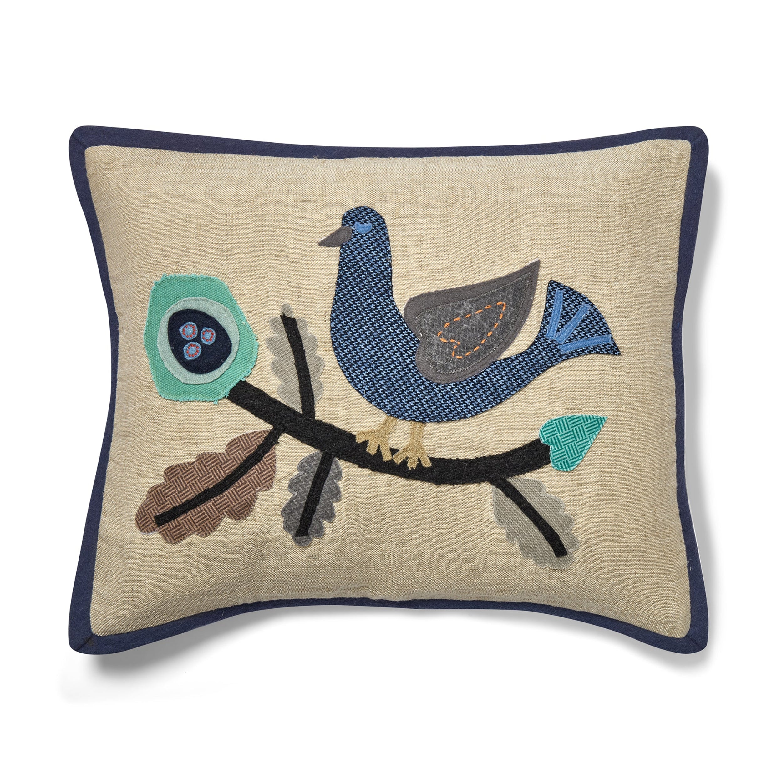 Decorative pillow with embroidered bird design on a beige background