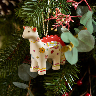 Playful Dragon Heart Dinosaur ornament is a fine china decorative piece perfect for Christmas tree decorations, and perfectly packaged in red and green box for festive gifting. 