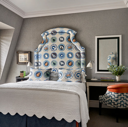 Powershaker bedspread in white features stitched scallop and line shapes, a perfect finish on Firmdale hotel beds, and exclusively available at Shop Kit Kemp.