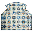 Front view of the Kit Kemp headboard in Ellie style, featuring a confident arc top and scalloped edges, upholstered in Robina's Dinner Party fabric. Exclusively at Shop Kit Kemp