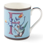 The purple cross hatched f on this pale blue mug forms a decorative background to the mythical winged creature, with its blue and yellow corn-like floral posy.