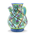 Highly decorated jug with  lattice trellis of branches, figs and eggs, on sky blue background and yellow accents.