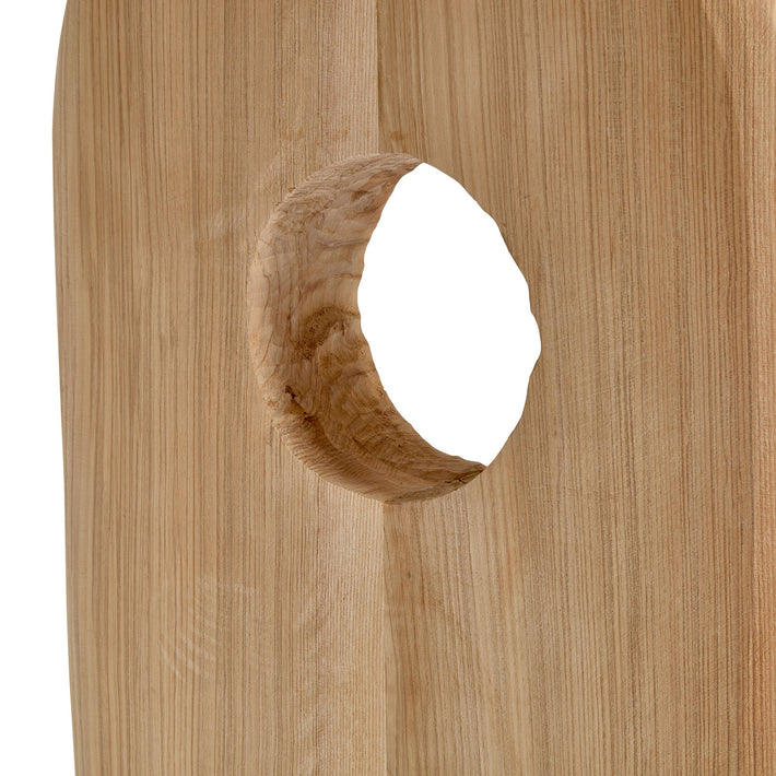 Wooden block with a circular hole on a white background