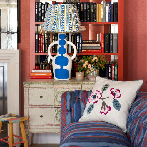 Flower Power Pink Cushion paired with High Tide Table Lamp in blue, and Zig Zag Pixie Side Table, for a playful interior combination of striped, floral, and organic shapes.