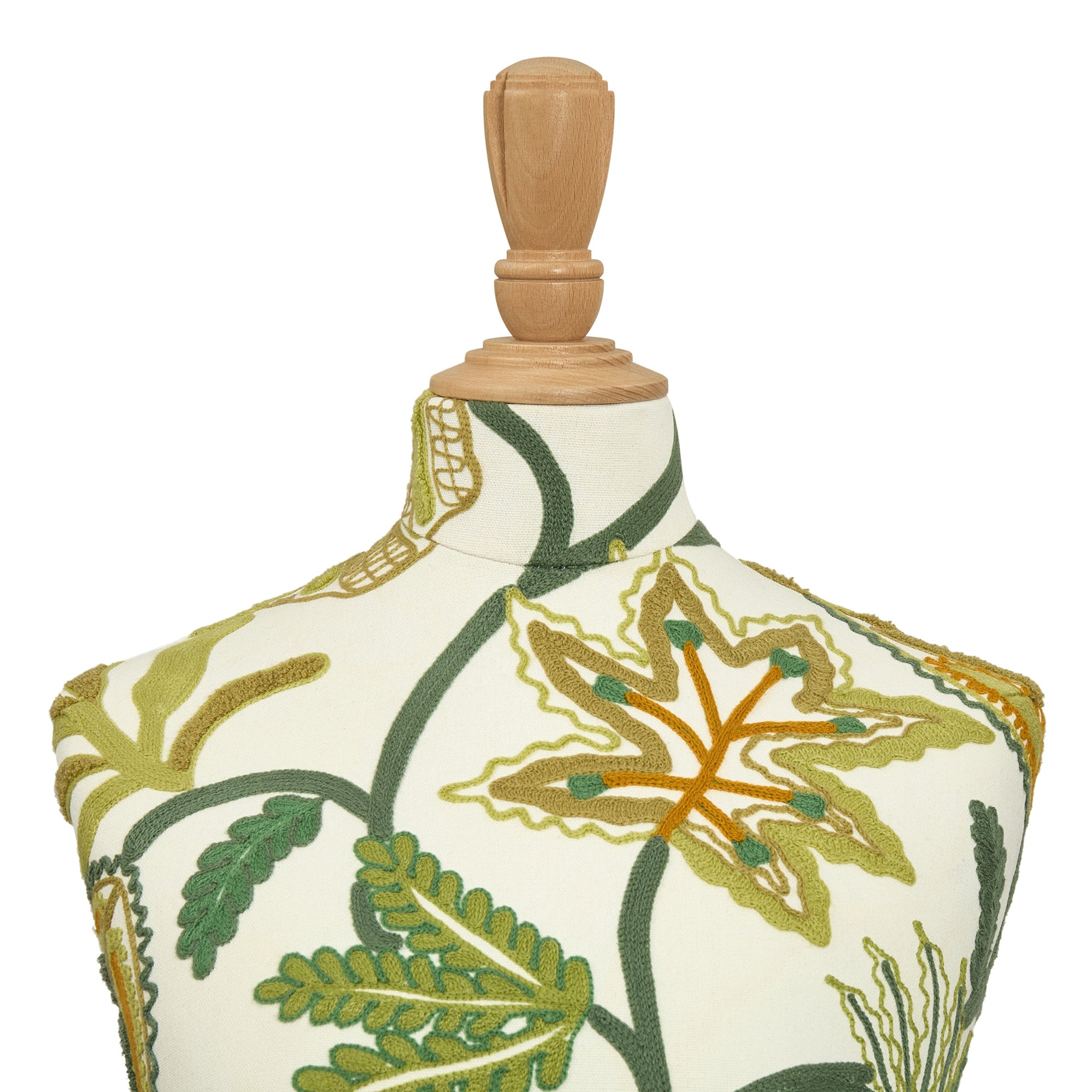 Mannequin torso with embroidered floral design on a white background