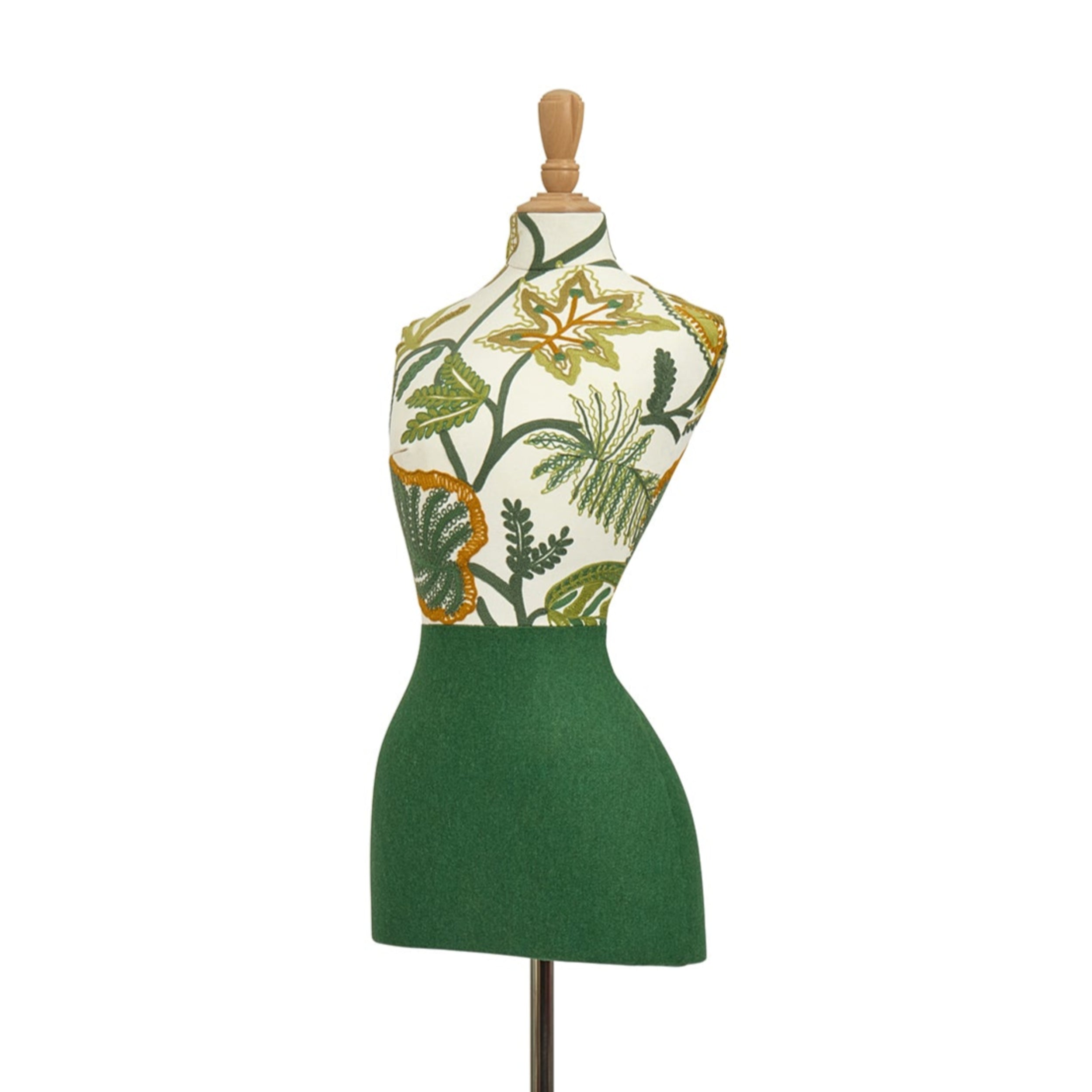 Mannequin torso with floral patterned top and green skirt on a white background
