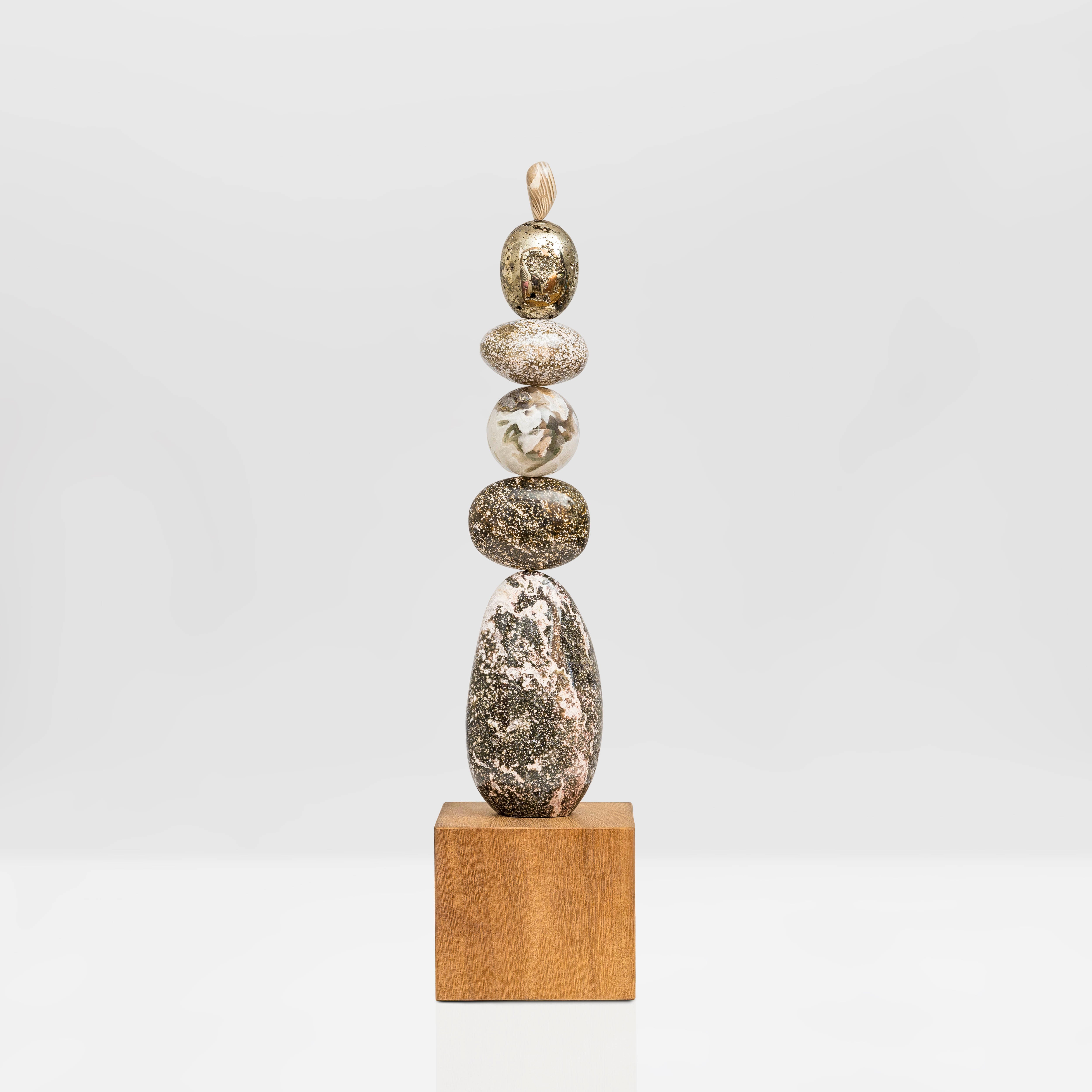 Galaxy Light totem is entirely unique and made from the following precious crystal stones: Pyrite foam, Ocean Jasper, a Moss Agate sphere, Ocean Jasper oval form, all sitting on a spectacular tall form of Ocean Jasper. Oak wood plinth base.