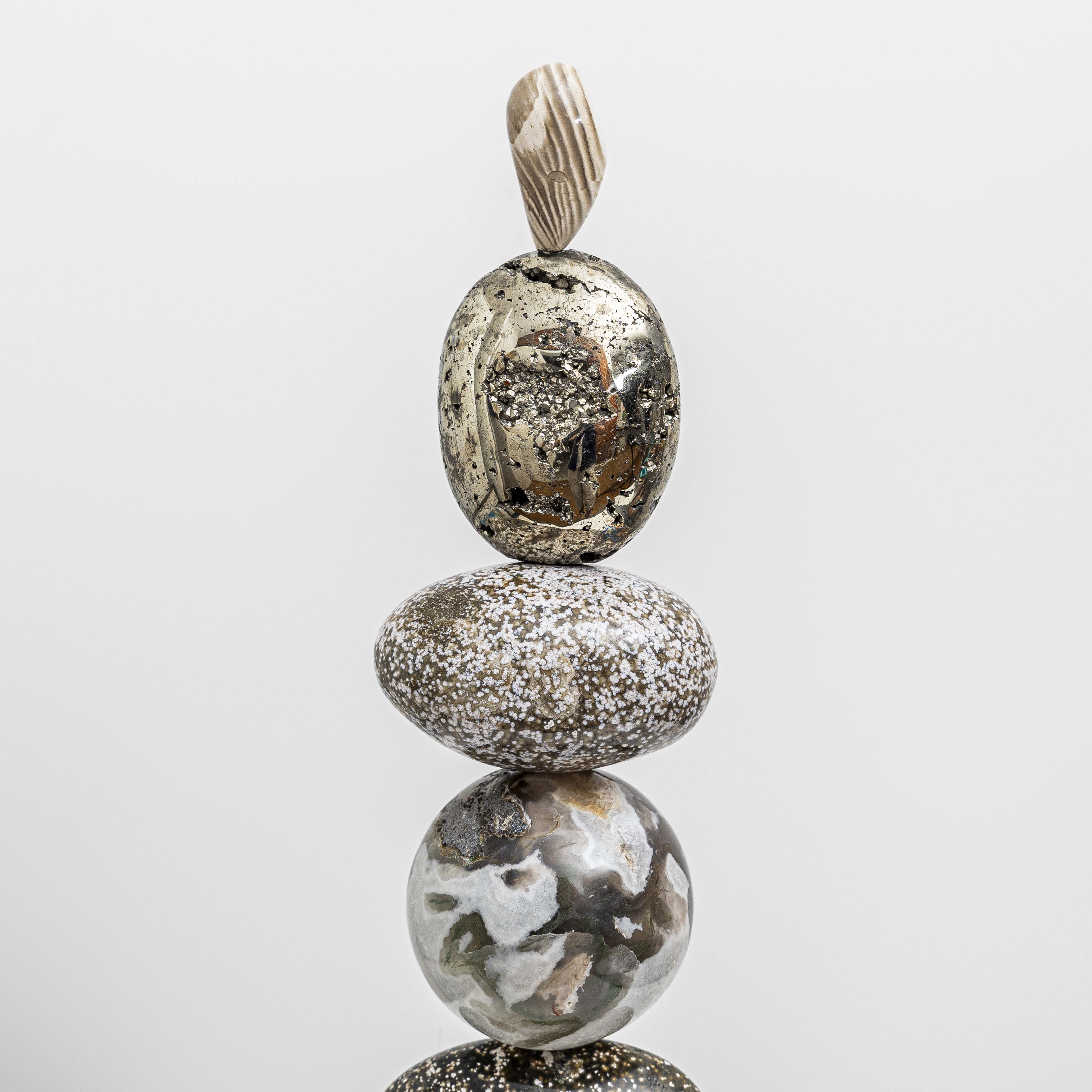 Artist Celia Lindsell creates unique artworks, and Galaxy Light features Pyrite foam, Ocean Jasper, a Moss Agate sphere, Ocean Jasper oval form, all sitting on Ocean Jasper and oak wood plinth base.