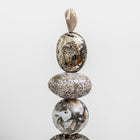 Artist Celia Lindsell creates unique artworks, and Galaxy Light features Pyrite foam, Ocean Jasper, a Moss Agate sphere, Ocean Jasper oval form, all sitting on Ocean Jasper and oak wood plinth base.