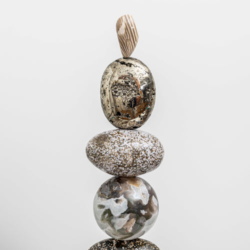 Artist Celia Lindsell creates unique artworks, and Galaxy Light features Pyrite foam, Ocean Jasper, a Moss Agate sphere, Ocean Jasper oval form, all sitting on Ocean Jasper and oak wood plinth base.