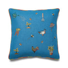 Kit Kemp blue cushions with ducks and chickens, each stitch tracing the swirls of bees and butterflies as they hover among blooms. 100% linen with rainbow piping.