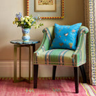Garden Shed On Blue Cushion on Min's Tub Chair in Zephyr Green fabric, both exclusively at Shop Kit Kemp.