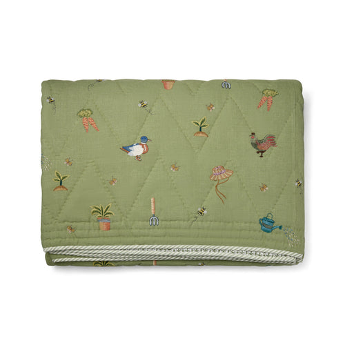 Garden Shed Quilted Bedspread in Green from the Weekend Collection by Kit Kemp - Chelsea Textiles, crafted from quilted linen with beautifully embroidered bees, butterflies, duck and wildflower motifs inspired by an English country garden.