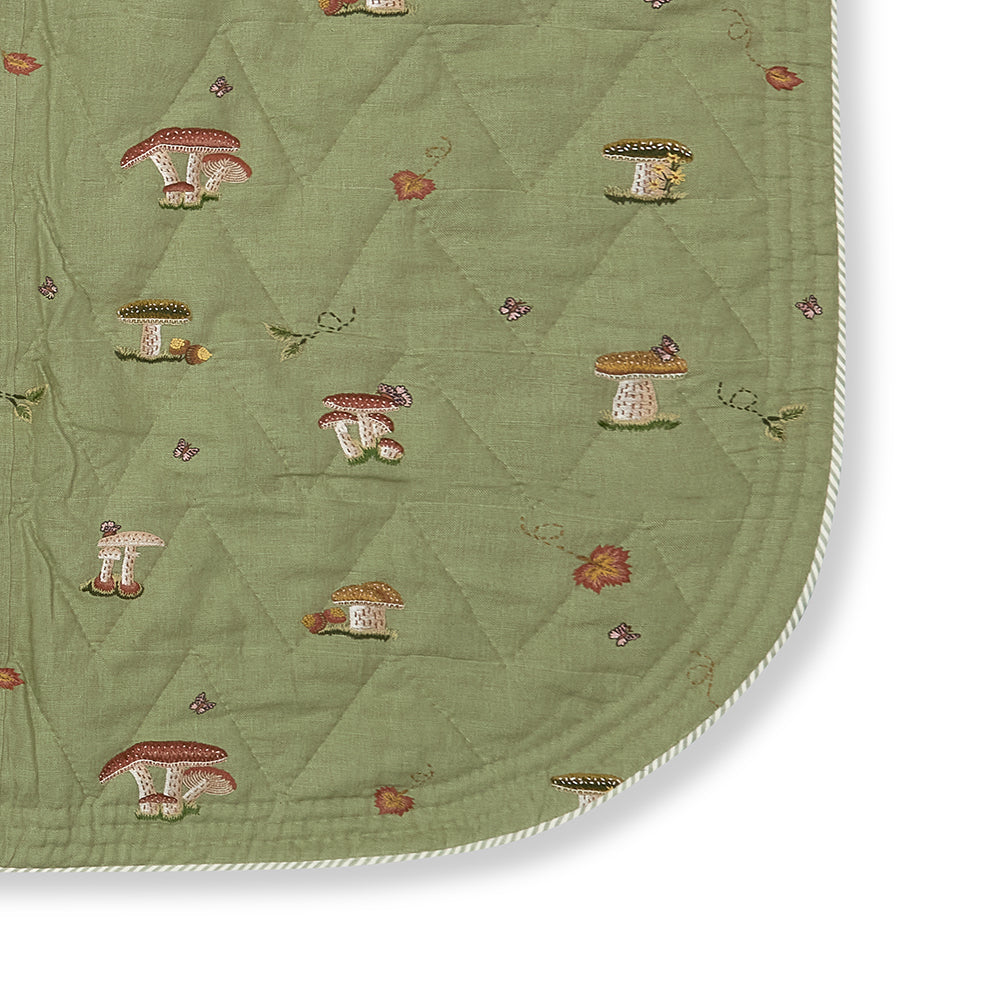 Close-up of the quilted linen reverse of the Good Trip Quilted Bedspread in Green, highlighting the refined stitching, luxurious texture and exceptional craftsmanship by Kit Kemp.