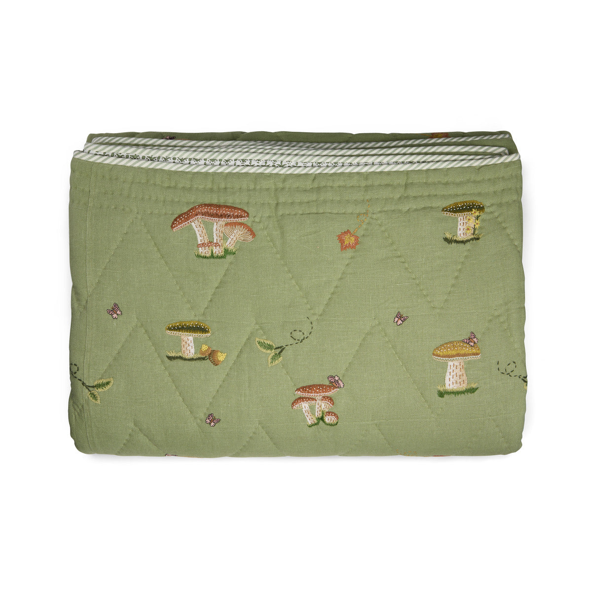 Good Trip Quilted Bedspread in Green from the Weekend Collection by Kit Kemp x Chelsea Textiles, crafted from quilted linen with embroidered woodland motifs and a beautifully bound finish.