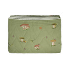 Good Trip Quilted Bedspread in Green from the Weekend Collection by Kit Kemp x Chelsea Textiles, crafted from quilted linen with embroidered woodland motifs and a beautifully bound finish.